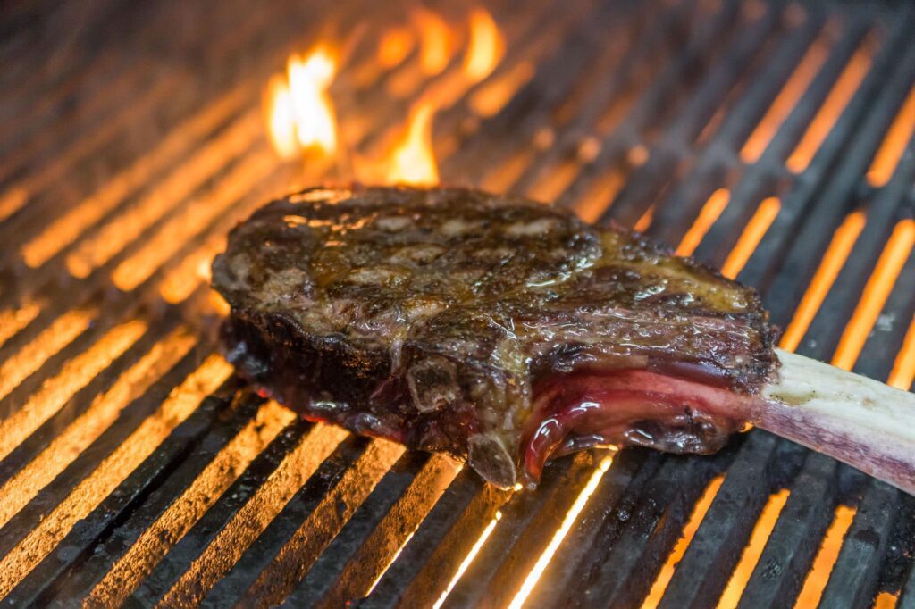 Steak over an open flame grill at Echo & Rig in Las Vegas NV