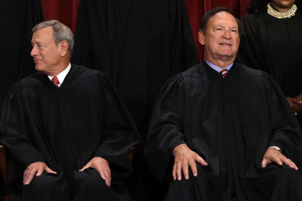 WASHINGTON, DC - OCTOBER 07: United States Supreme Court Chief Justice John Roberts (L) and Associate Justice Samuel Alito (R) pose for an official portrait at the East Conference Room of the Supreme Court building on October 7, 2022 in Washington, DC. The Supreme Court has begun a new term after Associate Justice Ketanji Brown Jackson was officially added to the bench in September. (Photo by Alex Wong/Getty Images)